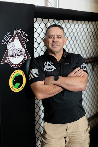 Professor Cris — 2nd-degree Paragon Jiu Jitsu black belt, Head Instructor in Brazilian Jiu-Jitsu