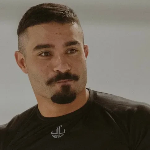 Guto Santos — Black belt (earned under Talita Treta), Head Instructor in Brazilian Jiu-Jitsu