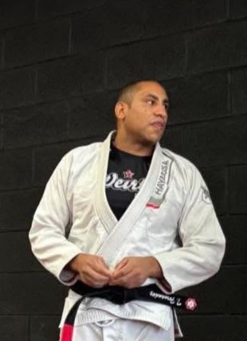 Troy Fernandez — 5th Degree Black Belt (Karate); active Black Belt in Brazilian Jiu Jitsu (training under Professor Lou Armezzani), Head Instructor in Brazilian Jiu-Jitsu